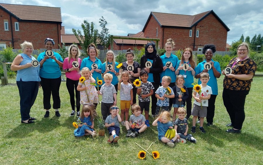 Pre-School Dogsthorpe staff with kids