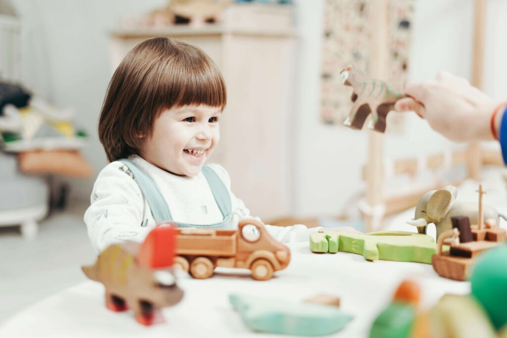 Girl at nursery playing with toys