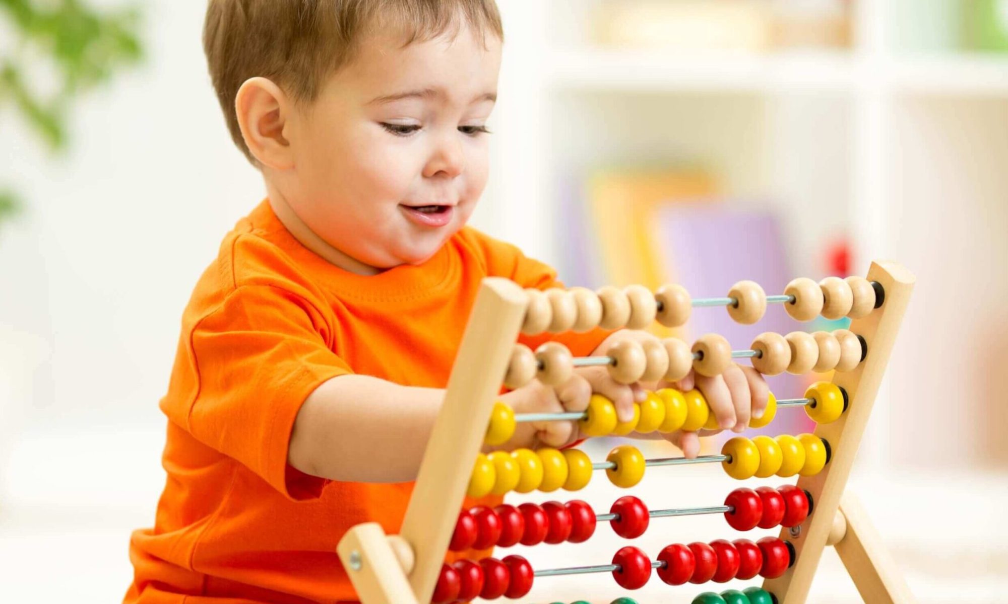 baby playing with abacus